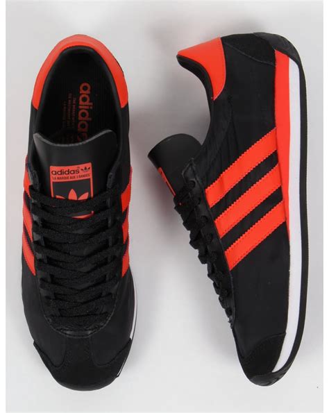 adidas oranje sneakers|adidas black and orange shoes.